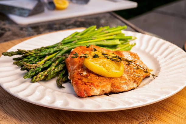 istock Grilled salmon on a plate with asparagus 1058964428