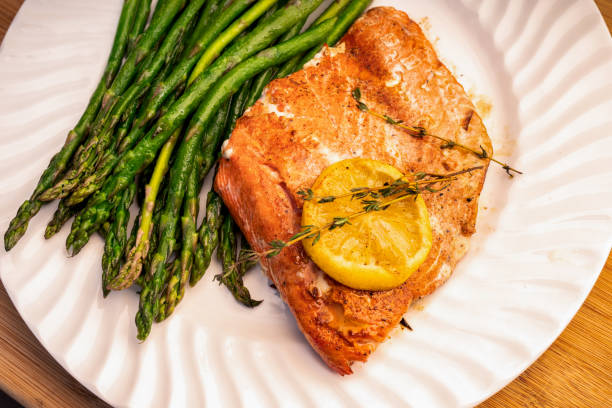 istock Grilled salmon on a plate with asparagus 1058964430