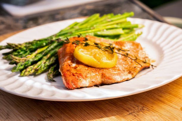 istock Grilled salmon on a plate with asparagus 1058964432