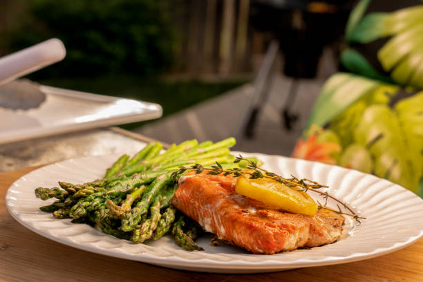 istock Grilled salmon on a plate with asparagus 1058965478