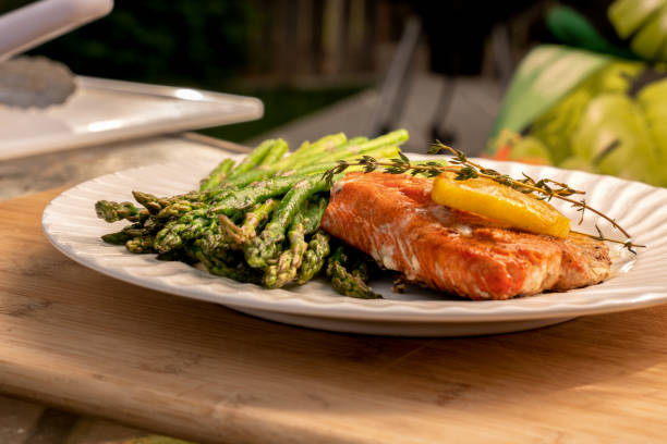 istock Grilled salmon on a plate with asparagus 1058965480