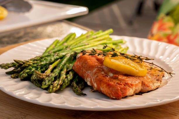 istock Grilled salmon on a plate with asparagus 1058966530