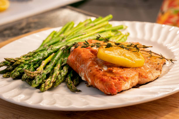 istock Grilled salmon on a plate with asparagus 1058966566
