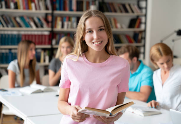 istock Female student researching at the library 1058967108