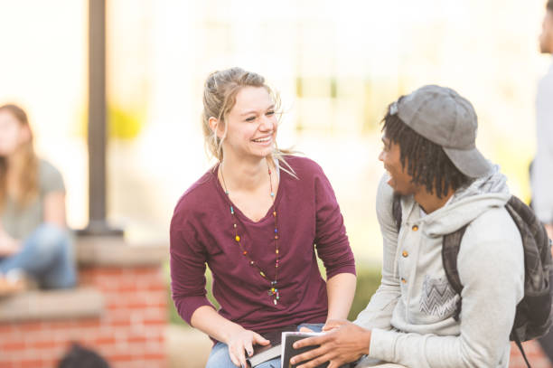 istock Two college students studying outside and reading the Bible 1058992176