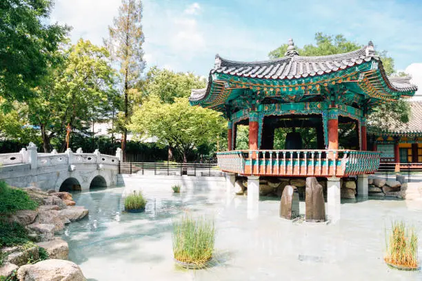 Photo of Korean traditional pavilion and pond at Gyeongsang-gamyeong park in Daegu, Korea