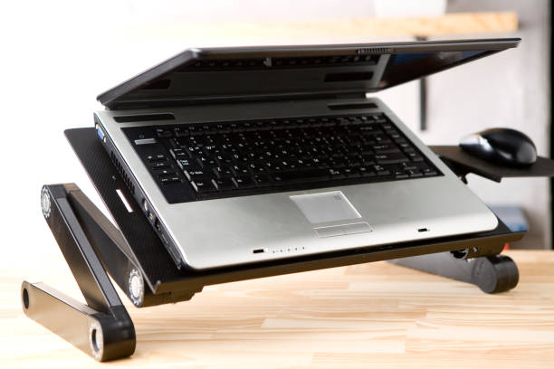 istock Laptop on wood table in Co-working or office. 1058997798