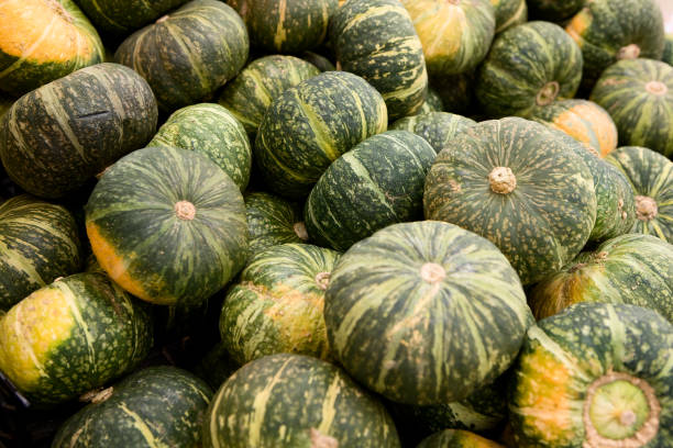istock Pumpkins on display at the mart. 1058998484