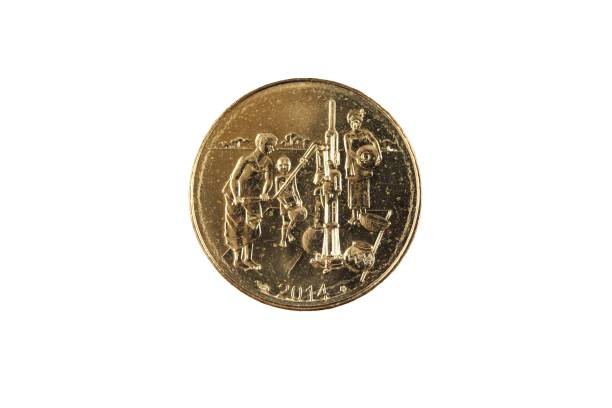 istock Golden 10 West African Franc coin on a white background 1059000246