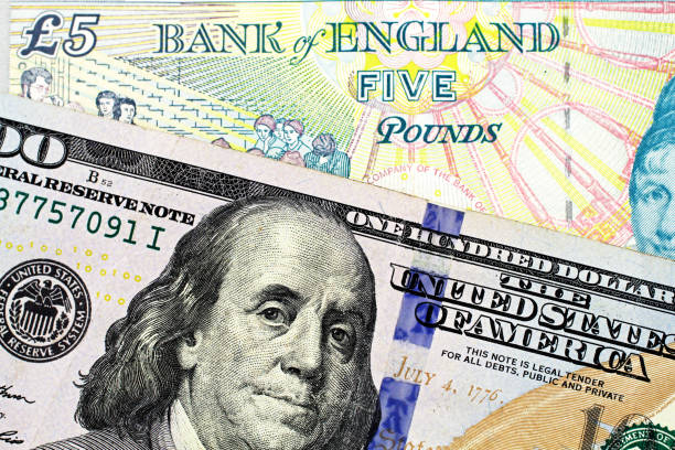istock A British five pound note with an American one hundred dollar bill 1059000378