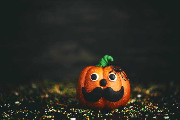 istock Halloween background with mustache face pumpkin character 1059016284