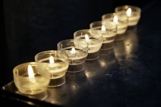 istock Candles lit in a church 1059022140