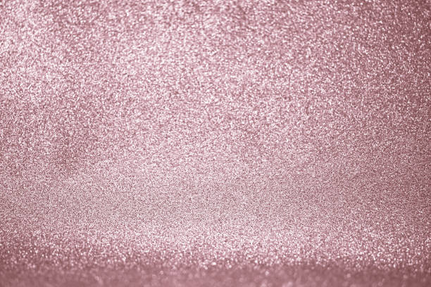 istock Rose gold glitter confetti defocused background texture. 1059024914