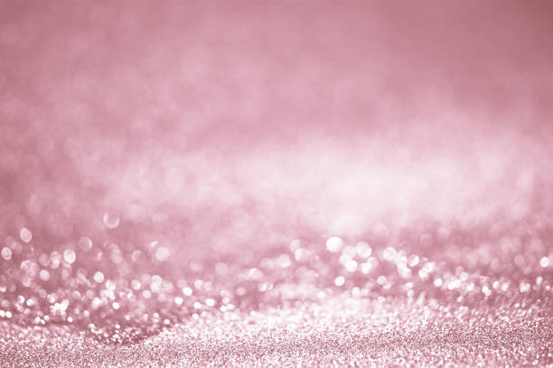 istock Rose gold glitter confetti defocused background texture. 1059026036