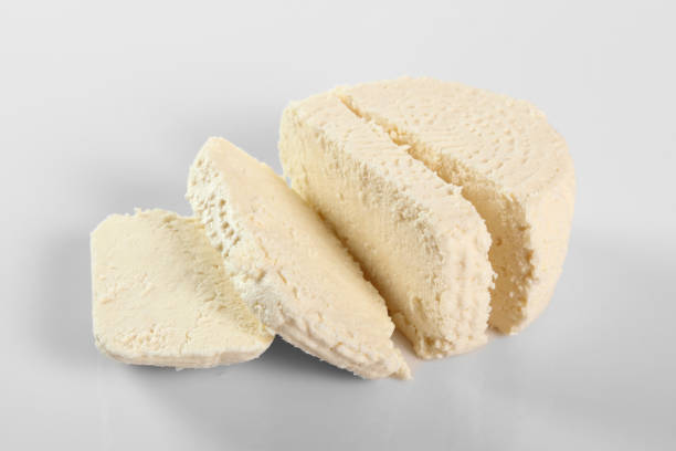 istock Capreggio Goat Cheese. Isolated on gray background. 1059041312