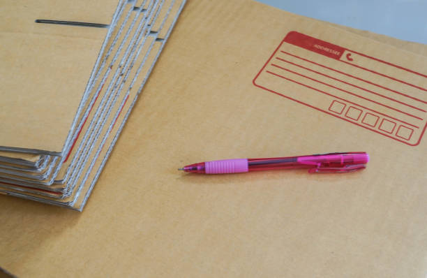 istock selective focus close up pen for writing on postal box for shipment 1059042696
