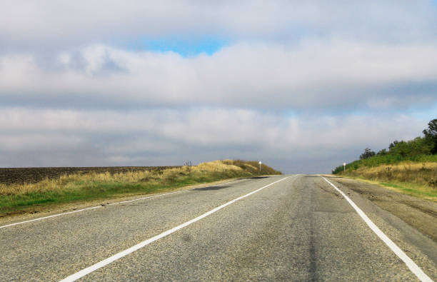 istock Highway landscape with moving cars at daytime 1059048098