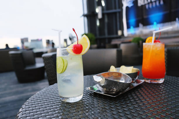 istock Two iced cocktail glasses in rooftop bar for nightlife 1059048272