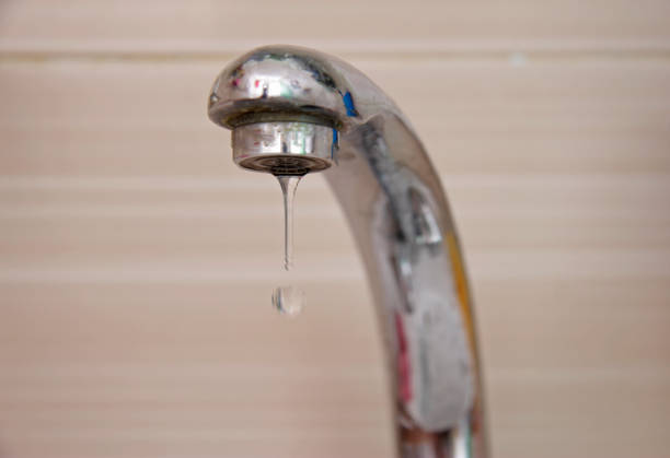 istock Drops of water falling down from the crane 1059048360