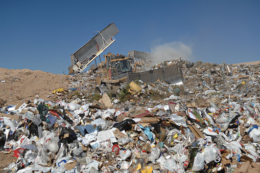 Equipment Working to Control Landfill Waste in Arizona