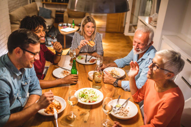 istock Lovely family with guests having a dinner 1059055614