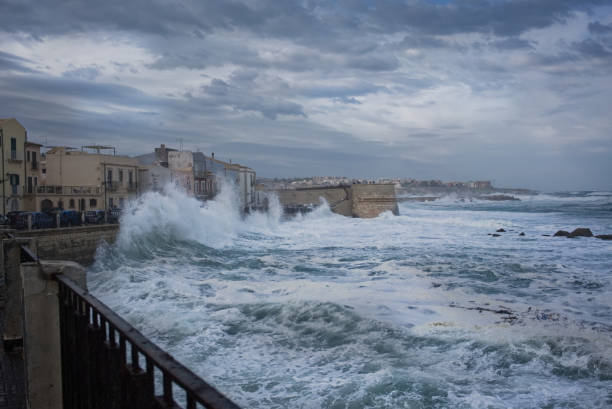 A Mediterranean hurricane touches dowon on the small island which is the historical centre of Siracusa