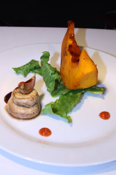 istock Finely plated grilled assorted pumpkin and mushroom with green vegetables 1059066400