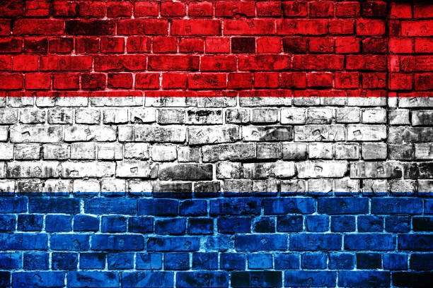 istock National flag of Luxembourg on a brick background. 1059066436