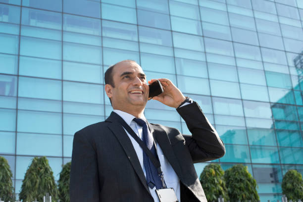 istock Businessman talking on mobile phone 1059076322