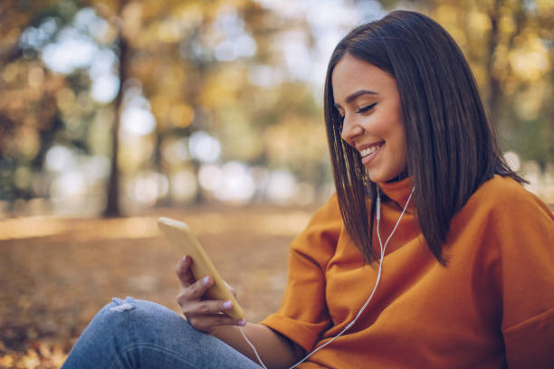 istock Beautiful woman in the park 1059083122