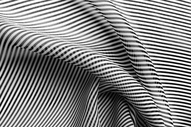istock Black and white striped pattern of silk, elegant fabric for backgrounds 1059086460