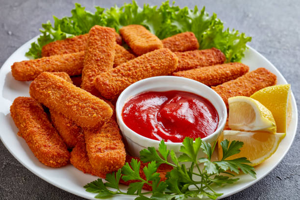 istock close-up of crumbed fish sticks, top view 1059087098