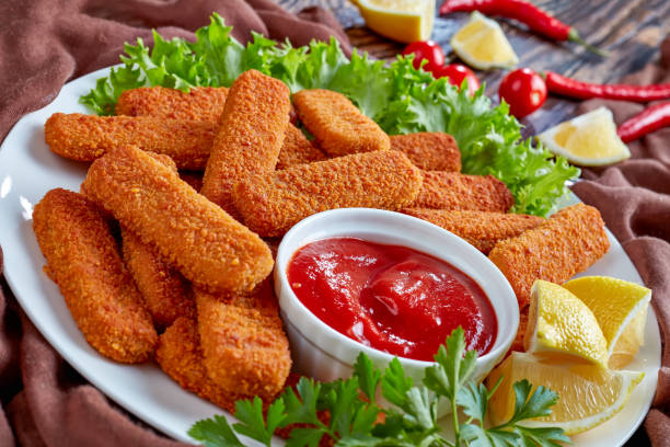 istock crumbed fish sticks served with ketchup 1059087238