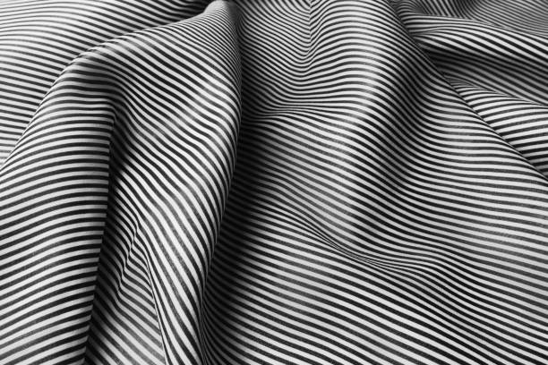 istock Black and white striped pattern of silk, elegant fabric for backgrounds 1059089718
