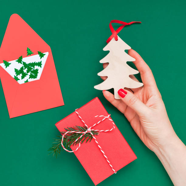istock Christmas greeting card with woman hand 1059089748