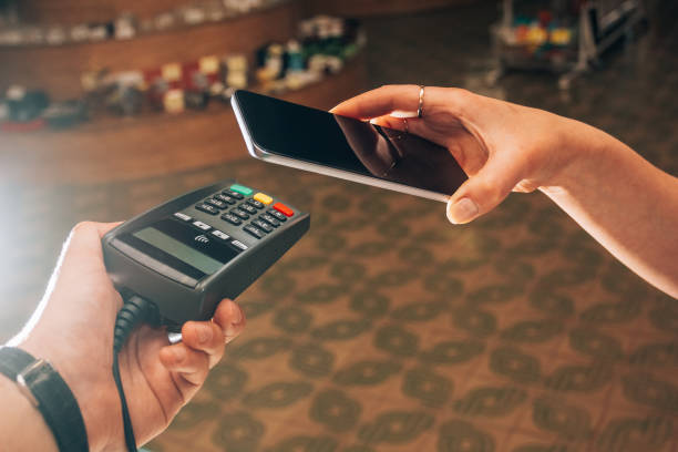 istock Terminal and smartphone during payment by NFC 1059091238