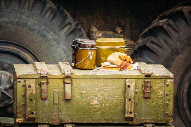 Soviet military pots with food on wooden boxes