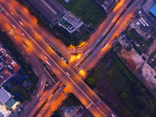 istock Aerial view of highway junctions. Bridge roads shape letter x cross in structure of architecture concept. Top view. Urban city, Bangkok, Thailand. 1059092434
