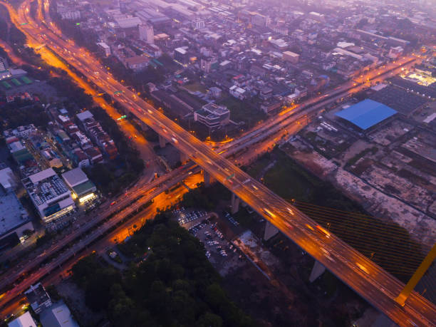 istock Aerial view of highway junctions. Bridge roads shape letter x cross in structure of architecture concept. Top view. Urban city, Bangkok, Thailand. 1059092484