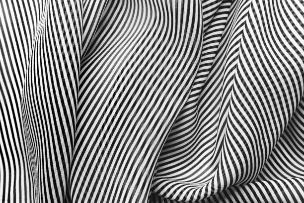 istock Black and white striped pattern of silk, elegant fabric for backgrounds 1059093914
