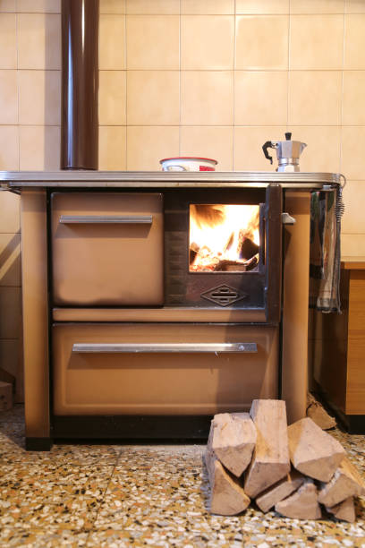 istock fire lit in a stove with wood to burn out 1059101762