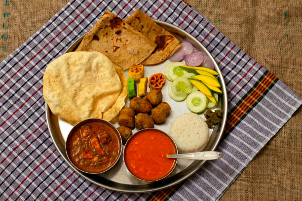 istock Authentic Maharashtrian lunch thali with Amras and poli, India. 1059101788