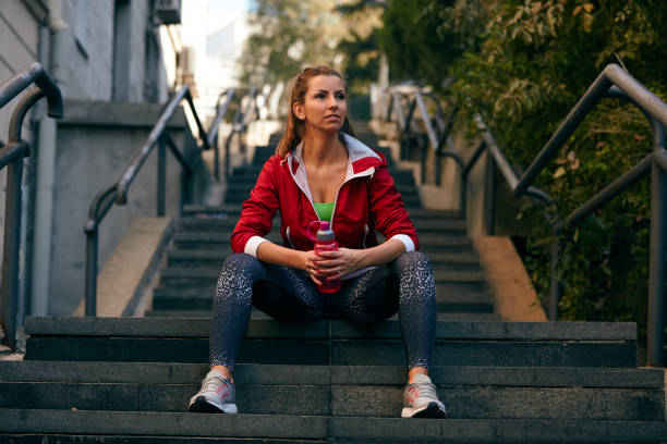 istock Fitness woman taking a break after workout. 1059108842