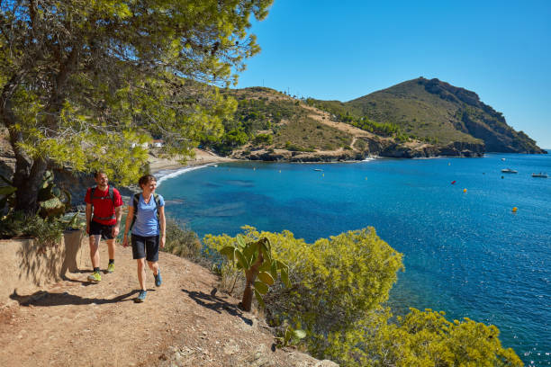 istock Young couple walking next to the sea 1059111248