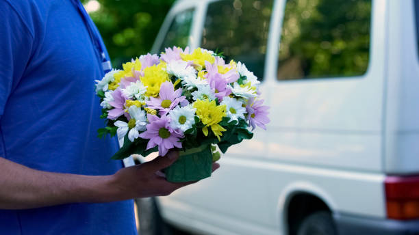 istock Courier delivery beautiful fresh bouquet, anniversary present, birthday gift 1059113590