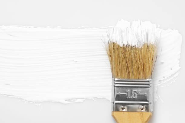 istock White paint stroke and brush 1059118308