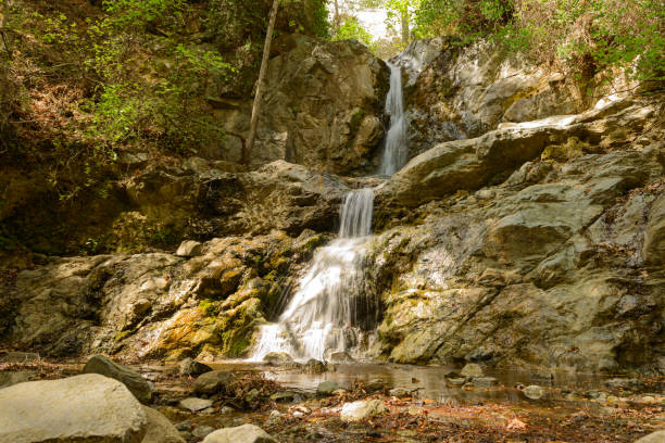 istock waterfall in rocky terrain on a sunny summer day 1059118722