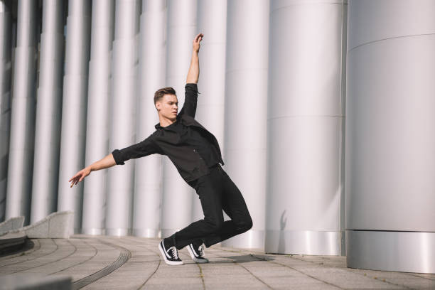 istock young man performing contemporary dance on street 1059119190