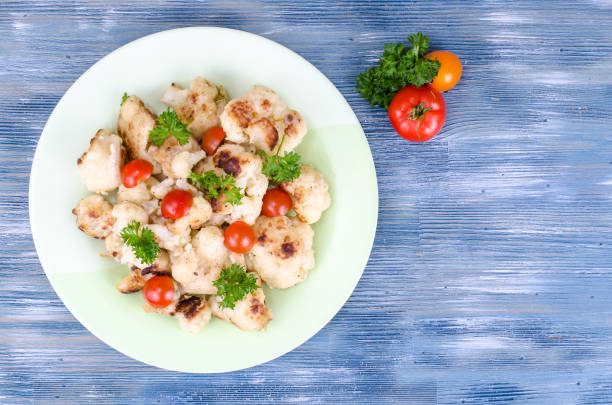 istock Dietary dish of cauliflower with tomatoes 1059121952