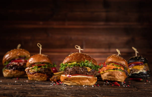 istock Delicious hamburgers, served on wood 1059121994